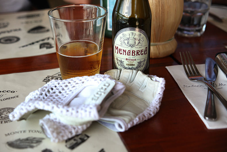 cycling gloves and an Italian beer