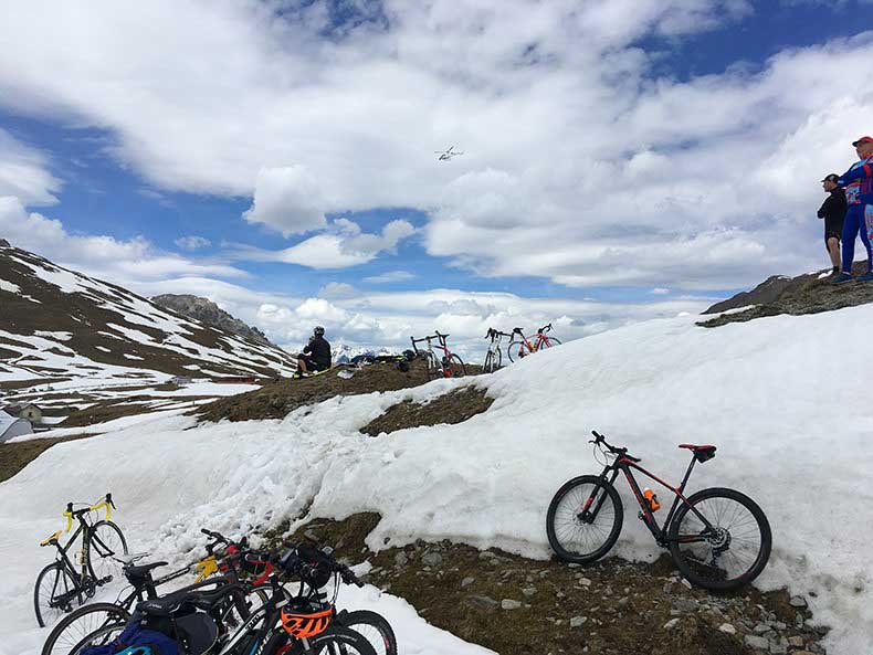 Bikes in the snow at the top of Passo Stelvio