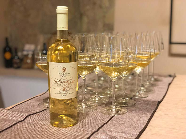 A bottle of Fiano from Puglia and glasses filled for a tasting