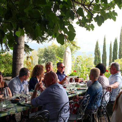 A group of riders and non riding partners enjoying a long Tuscan lun