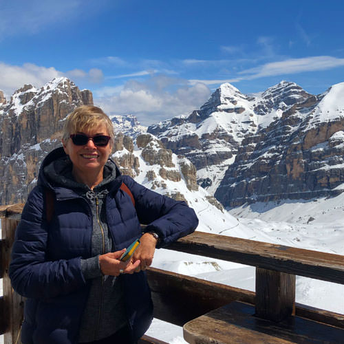 A lady in the snow in the Dolomites