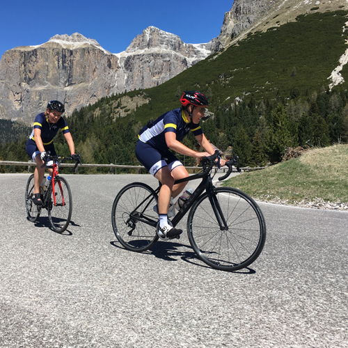 Two women cycling in the Dolomites on an Italian cycling holiday