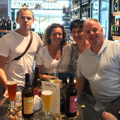 Four people enjoying aperitivo in Italy
