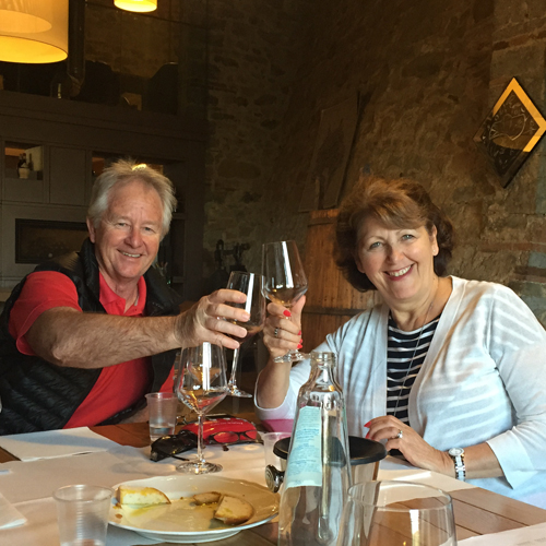 A couple at a wine tasting in Tuscany