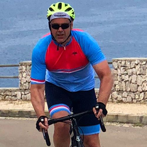 A man riding a bicycle on a cycling holiday in Puglia