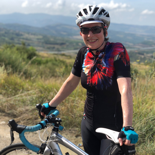A lady and her bicycle on holidays in Tuscany