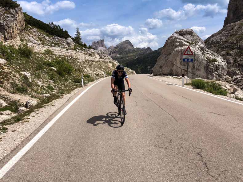 A cyclist riding to the top of Passo Valporola