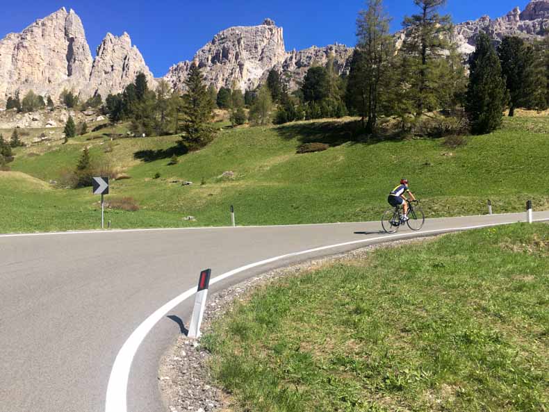 A woman riding in the dolomites