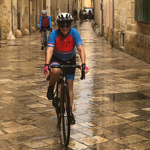 A lady riding on the cobble stone streets of Lecce