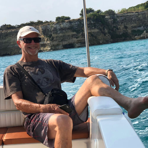 A man relaxing in a boat off Otranto