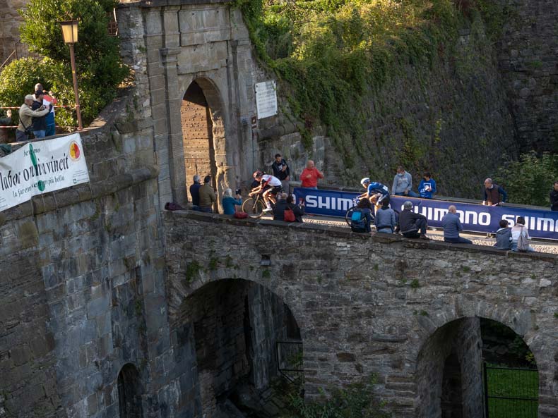 Giro d'Lombardia entering an old city gate