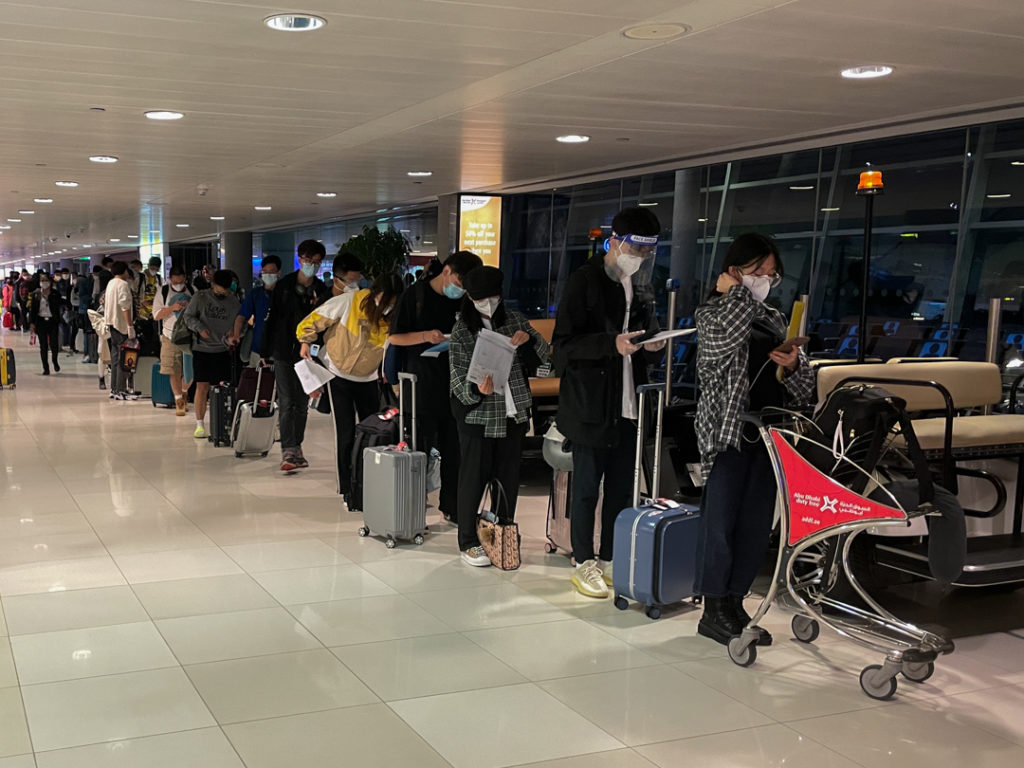 people queuing at the airport